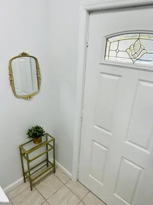 a white door with a mirror and a table at Newly renovated home, Fire pit, Games, Grill in Tobyhanna