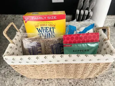 a basket filled with snacks and books on a counter at Newly renovated home, Fire pit, Games, Grill in Tobyhanna