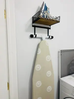 a surfboard in a room with a shelf on the wall at Newly renovated home, Fire pit, Games, Grill in Tobyhanna