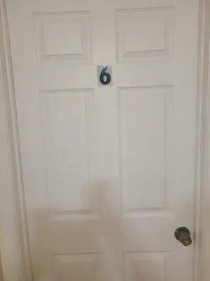 a white door with a door knob on it at Amazing family house in Newark