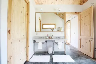 a bathroom with a sink and a mirror at Luxurious Modern Chalet Rental on Top of the Shawangunk Mountains in New York in Cragsmoor