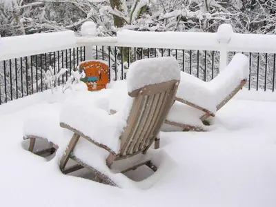 a bench covered in snow next to a fence at Stunning Weekend Getaway near Hickory Run State Park in Pennsylvania in Jim Thorpe