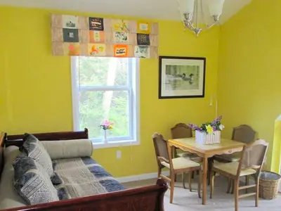 a living room with a couch and a table at Stunning Weekend Getaway near Hickory Run State Park in Pennsylvania in Jim Thorpe