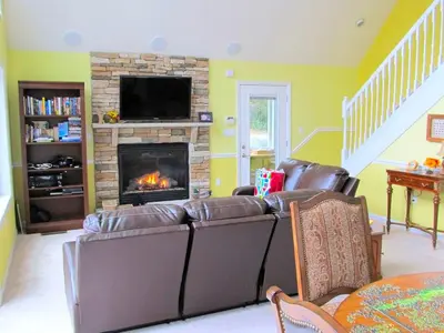 a living room with a couch and a fireplace at Stunning Weekend Getaway near Hickory Run State Park in Pennsylvania in Jim Thorpe