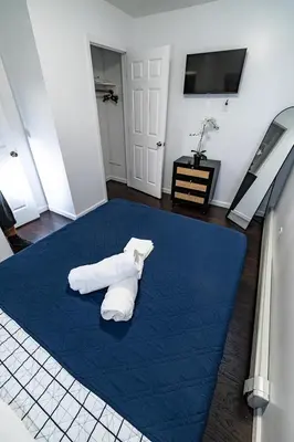 a room with a bed with two pillows on it at Hudson Haven-Near NYC Transit in West New York