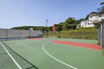 a tennis court with a tennis court at Home in Bushkill Saw Creek Poconos area in Saw Creek