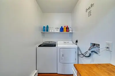 a small kitchen with a washing machine in a room at Home in Bushkill Saw Creek Poconos area in Saw Creek