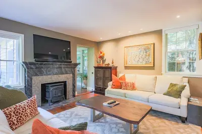 a living room with a couch and a fireplace at John Quigley House - Downtown New Hope in New Hope