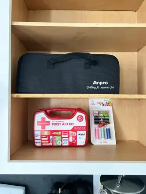 a drawer with a first aid kit and a suitcase at Newly renovated home, firepit, game room, grill in Tobyhanna