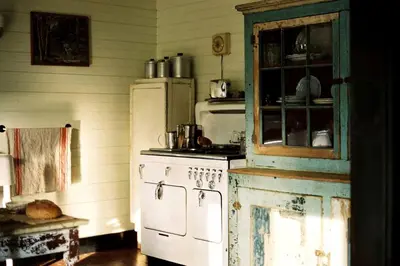 a kitchen with an old stove and a refrigerator at Charming Cottage Rental with Antique Decor in Narrowsburg, New York in Narrowsburg
