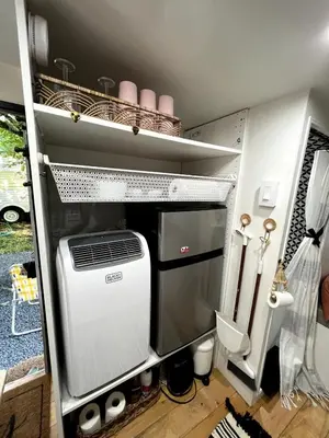 an rv with a air conditioner in a room at Vintage Shasta Camper for the best of NYC Glamping in Livingston Manor