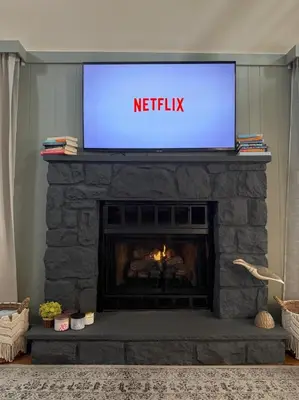 a television on top of a fireplace with a tv above it at Pocono Chalet,Hot Tub,Arcade,Fireplace, Lake,Pool, Pet friendly, near Jim Thorpe No extra fees to use amenities in Towamensing Trails