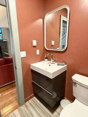 a bathroom with a sink and a mirror at Pocono Chalet,Hot Tub,Arcade,Fireplace, Lake,Pool, Pet friendly, near Jim Thorpe No extra fees to use amenities in Towamensing Trails
