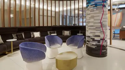 a lobby with purple chairs and a couch at The Vibe on 5th IV Vibe 8753 in New York