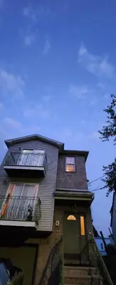 a tall house with a window and a door at Gold queen 4A in Newark