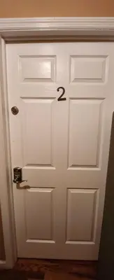 a white door with the number on it at Gold queen 4A in Newark