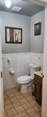 a bathroom with a toilet and a sink at Happiness queen room 3 in Newark