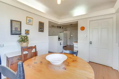 a kitchen and dining room with a wooden table at Historic Manor 3 Mi to Shawnee Mtn! Pet Friendly in East Stroudsburg