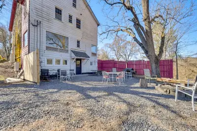a large white barn with a table and chairs at Historic Manor 3 Mi to Shawnee Mtn! Pet Friendly in East Stroudsburg