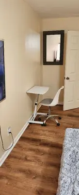 a room with a desk and a chair in it at Beautiful Room king in Newark