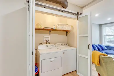 a small laundry room with a washer and dryer at Family-Friendly Townhome with Patio in Columbia! in Columbia