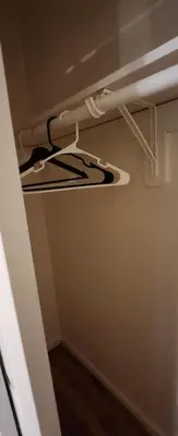 a white shelf in a room with a ceiling at Lemon king room 4 in Newark