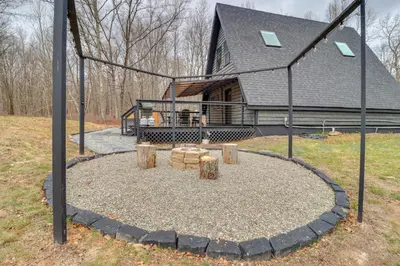 a playground in front of a house at 9 Mi to Big Boulder Mtn A-Frame Cabin with Hot Tub in Albrightsville