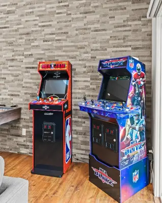 two arcade games next to each other in a room at Home at Camelback Mtn with Game Room near Waterparks in Tannersville