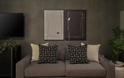 a living room with a couch and a refrigerator at Luxury Apartments by Hyatus Center City in Philadelphia