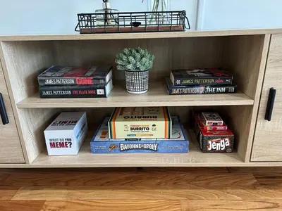 a book shelf filled with lots of books at NYC 20min, Sleeps 10, Free Parking, Patio in Bayonne