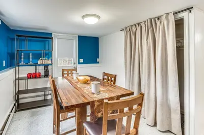 a dining room with a wooden table and chairs at Home 2 Mi to Thayer Gate at U S Military Academy in Highland Falls