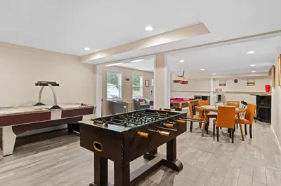a living room with a pool table and a piano at Spacious Game Room Seclusion Hot Tub and more in Long Pond