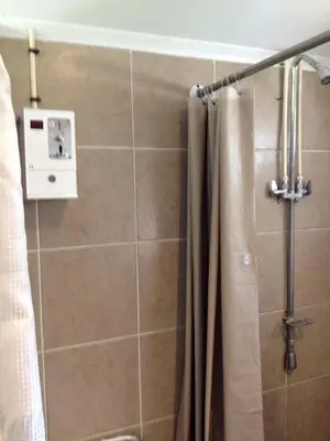 a bathroom with a shower with a shower curtain at Rustic Cabin Rental on Family-Friendly Campsite near Harrisburg, Pennsylvania in Millmont