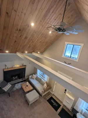an overhead view of a living room with a fireplace at Cabin with Sauna Close to Skiing in Arrowhead Lake