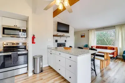 a kitchen with white cabinets and a counter top at Beach Access BBQ-Ready Poconos Family Getaway! in Blakeslee