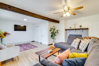 a living room with a couch and a ceiling fan at Beach Access BBQ-Ready Poconos Family Getaway! in Blakeslee