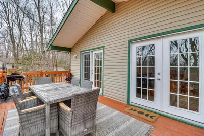 a patio with a table and chairs on a house at Beach Access BBQ-Ready Poconos Family Getaway! in Blakeslee