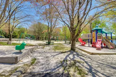 a park with a playground with a slide at Beach Access BBQ-Ready Poconos Family Getaway! in Blakeslee