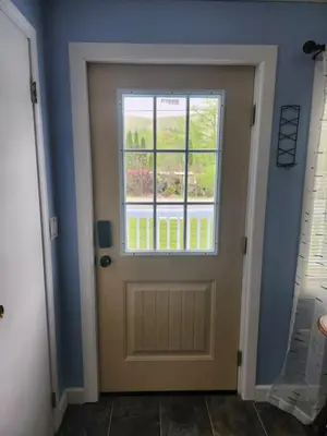 a door with a window in a room at Countryside Comfort in Willseyville