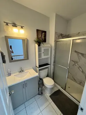 a bathroom with a sink and a toilet and a shower at 4 ROOMS FAMILY HOUSE WITH BACKYARD, LAUNDRY AND PARKINg in Union City