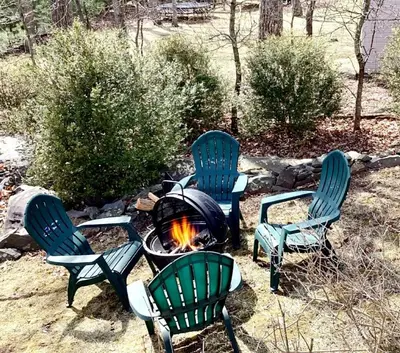 a group of chairs around a fire pit at Hilltop Villa in East Stroudsburg