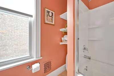 a bathroom with a shower and a window at Downtown Lancaster Luxury 4BR - Garage & Parking in Lancaster