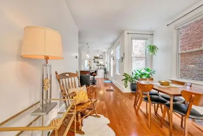 a dining room and living room with a table and chairs at Downtown Lancaster Luxury 4BR - Garage & Parking in Lancaster