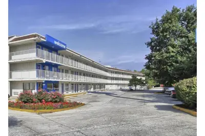 an empty parking lot in front of a hotel at Cumberland Inn By OYO New Cumberland-Hershey South in New Cumberland
