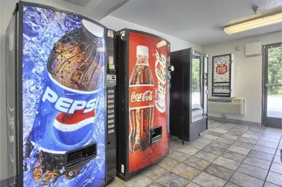 two vending machines in a room with soda bottles at Cumberland Inn By OYO New Cumberland-Hershey South in New Cumberland