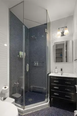 a bathroom with a shower and a sink at Explore NYC! Cozy 2BR in Prime Location in New York