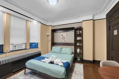 a bedroom with a bed in a room at NYC Premier Walking Distance to Times Square in New York