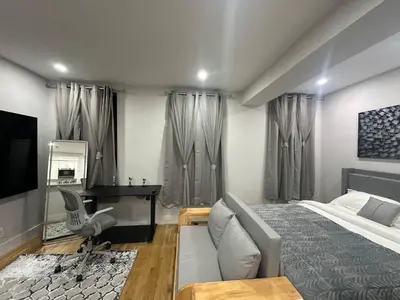 a bedroom with a bed and a desk at The Gray Loft Escape NYC Edition. in New York