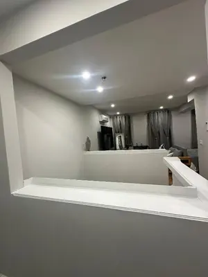a room with white walls and a white shelf at The Gray Loft Escape NYC Edition. in New York