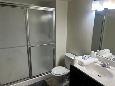 a bathroom with a shower and a toilet and a sink at 1500 Locust Apartments Luxury Living in the Heart of Philadelphia in Philadelphia
